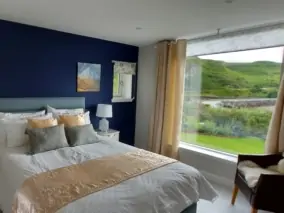 Luxurious bedroom with view over Loch