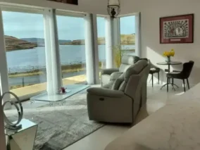 Living room with complete oecean view through panoramic windows